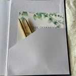 pocket attached to the back cover to hold important notes & or a pen or two